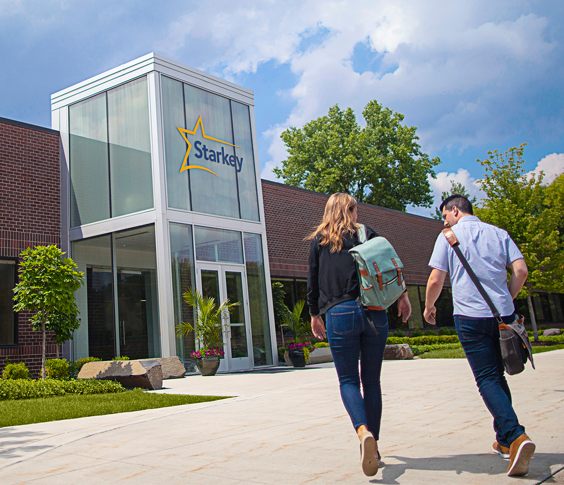 3 people playing soccer